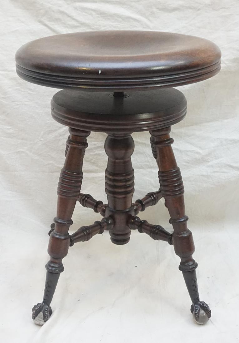 MAHOGANY PIANO STOOL: Antique Mahogany Adjustable Piano Stool. Ball and Claw Feet. Measures 14"x14"x19". Weight 18 pds.