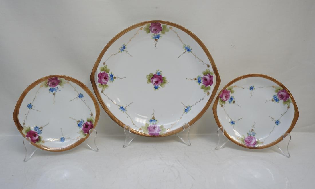 3 PC NIPPON DESSERT SET: TE-OH China Nippon Hand Painted Japan Cake Plate with 2 Dessert Plates. Hand Painted Roses and Violets, Gilt enameled accents2. Cake plate 10 1/4". Dessert Plates 6 1/2". Weight on all 1 pd 14 oz. PRO
