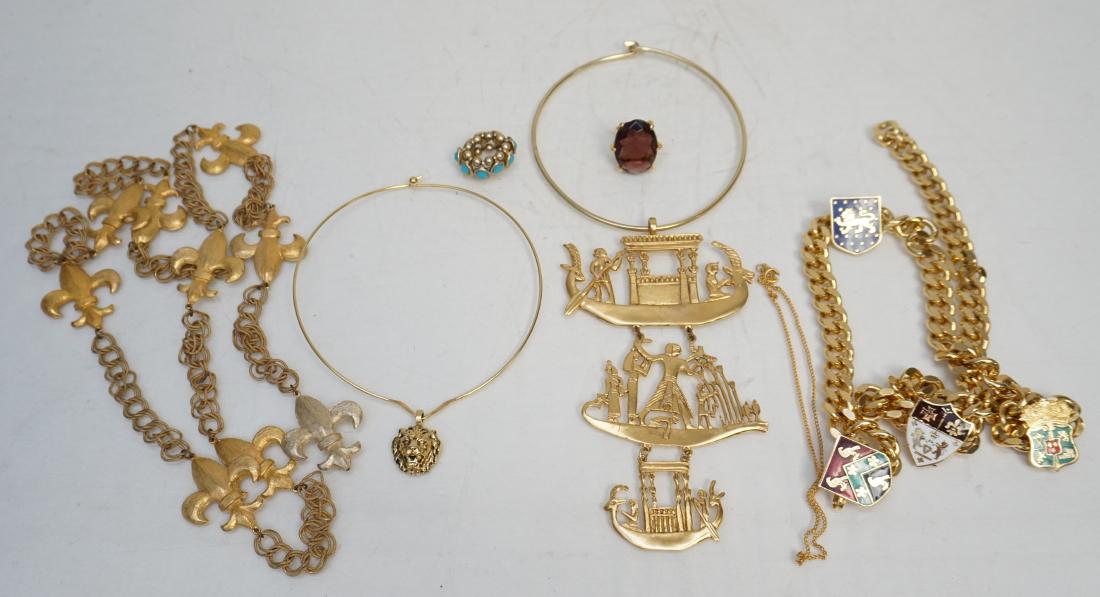 6 VINTAGE ESTATE KENNETH LANE + BELTS: All are Vintage Estate. Good condition. 1- Mark XIV Link Belt with enamel coat of arms. 32" Opened. 2- Double Chain Belt with Fleur de Lis 49" opened. 3- Amethyst Glass Ring. 4- Faux Turquoise Stretch