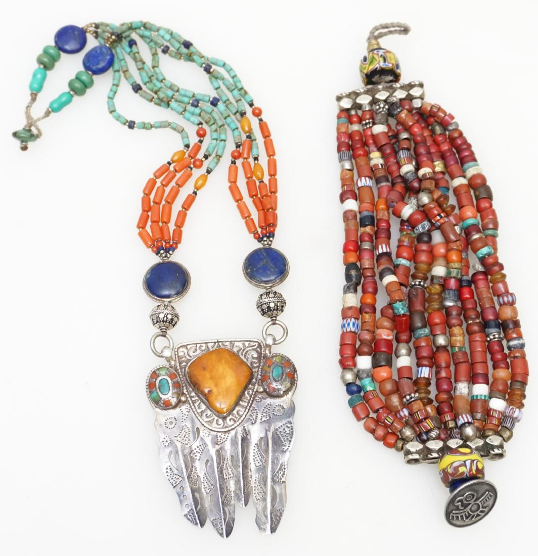 2 TIBETAN NECKLACE + BRACELET: 1- Tibetan Silver Statement Necklace with Turquoise, Coral, Lapis and Amber. 12" including 3" pendant. 2- 10 Strand Natural Stone Bracelet 8 1/2" opened. Both in very good condition. Weight 7 oz. PROV