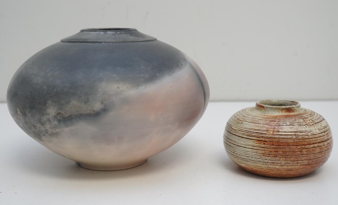 2 pc STUDIO ART POTTERY MICHAEL BROSTKO + KEN MCDONALD: 1- Michael Brostko (b. 1951) Studio Art Pottery Raku Vase in Rose and Black. Measures 8"x8"x6". Michael Brostko made wheel-thrown stoneware and porcelain pottery. He started working with clay in 1974,