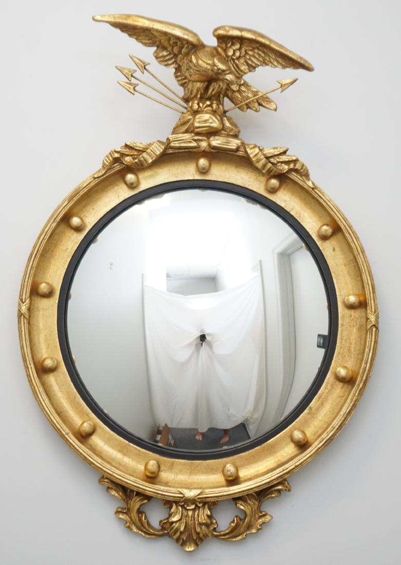 FEDERAL STYLE BULLSEYE MIRROR: Vintage Friedman Brothers American Style Federal Gilt Bullseye Mirror. Circular girandole convex mirror with eagle and arrows at top, made by Friedman Brothers. Measures 33 1/2" h x 24 1/2". PROVENANC