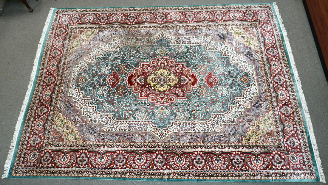 LARGE 12 FT KASHMIR HAND KNOTTED SILK RUG INDIA: Large 20th c. Kashmir Silk Hand Knotted India Kirman Design Area Rug. Teals, reds, cream. 12 Foot by 9 Foot. Measures 145" x 108" (fringe 2 1/2" each side). Good Condition.**ALL FURNITURE & LARGE ITEM