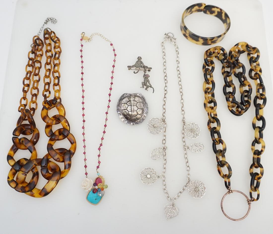7 PC COSTUME JEWELRY MIGNON FAGET +: 1- Mignon Faget Turtle Shell Brooch / Pendant 1 3/4". A fifth generation New Orleanian, Mignon Faget is a jewelry designer based in her native New Orleans, Louisiana. Faget has long been acknowledged 