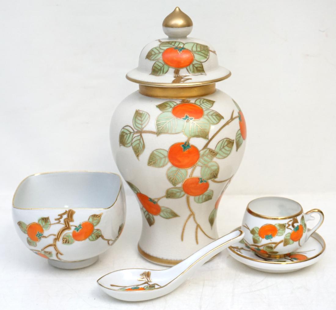 3 PC JAPANESE PERSIMMON KUTANI: 3 Pc Vintage Japanese Kutani Porcelain. All are with hand painted Persimmons and gilt accents, all are signed. Rice Bowl 4"x4"x3 and Spoon, Tea cup with Geisha Head in bottom and saucer . Ginger Jar 1