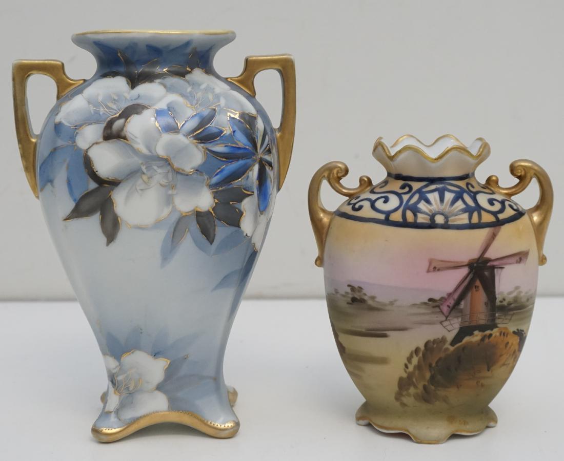 2 HAND PAINTED NIPPON VASES: 2 Vintage Hand Painted Nippon Vases. 1- Blue Hand Painted White Lilies 7 1/2". 2- Hand Painted Windmill Scene 5 1/2". Tiny nick to lip. Weight combined 1 pd 11 oz. PROVENANCE: A Private Pawleys Island