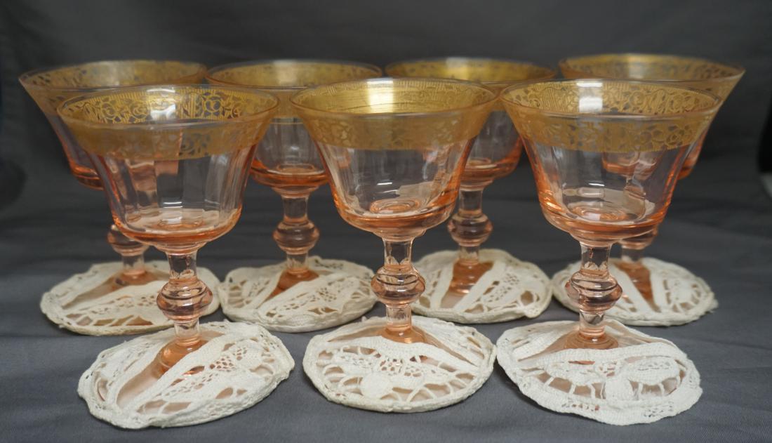 7 TIFFIN PINK DEPRESSION GLASSES: Seven Paneled Pink Depression Glasses by Tiffen. Gold Rims in the Rambler Rose Pattern. Each has a hand tatted slip on wine coaster also c. 1930s. Each glass 2 3/4"x2 3/4"x4". Weight on all 1 pd 10 oz