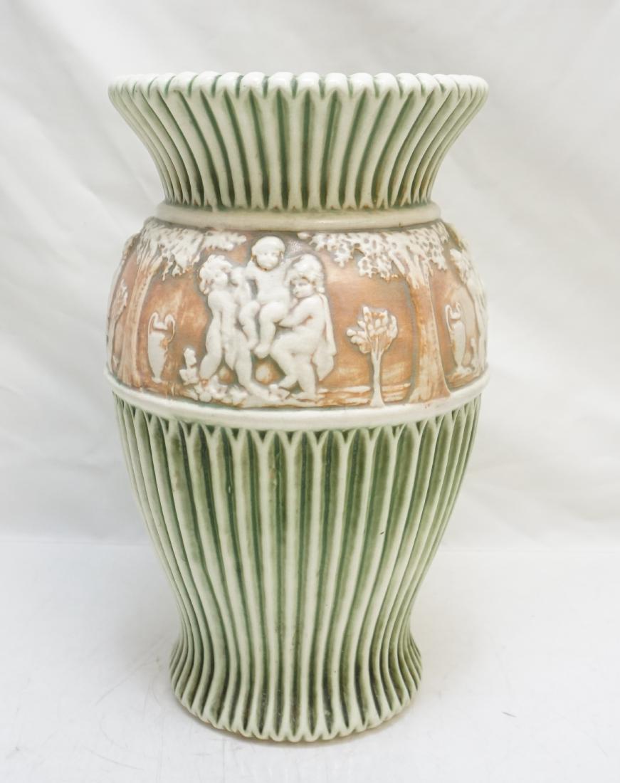 ROSEVILLE DONATELLO 12 VASE: Early Roseville Donatello 12" Vase. Very good condition with minor age expected crazing. Donatello was introduced by Roseville Pottery in 1916. Standard colors are green and white. Early Donatello pie