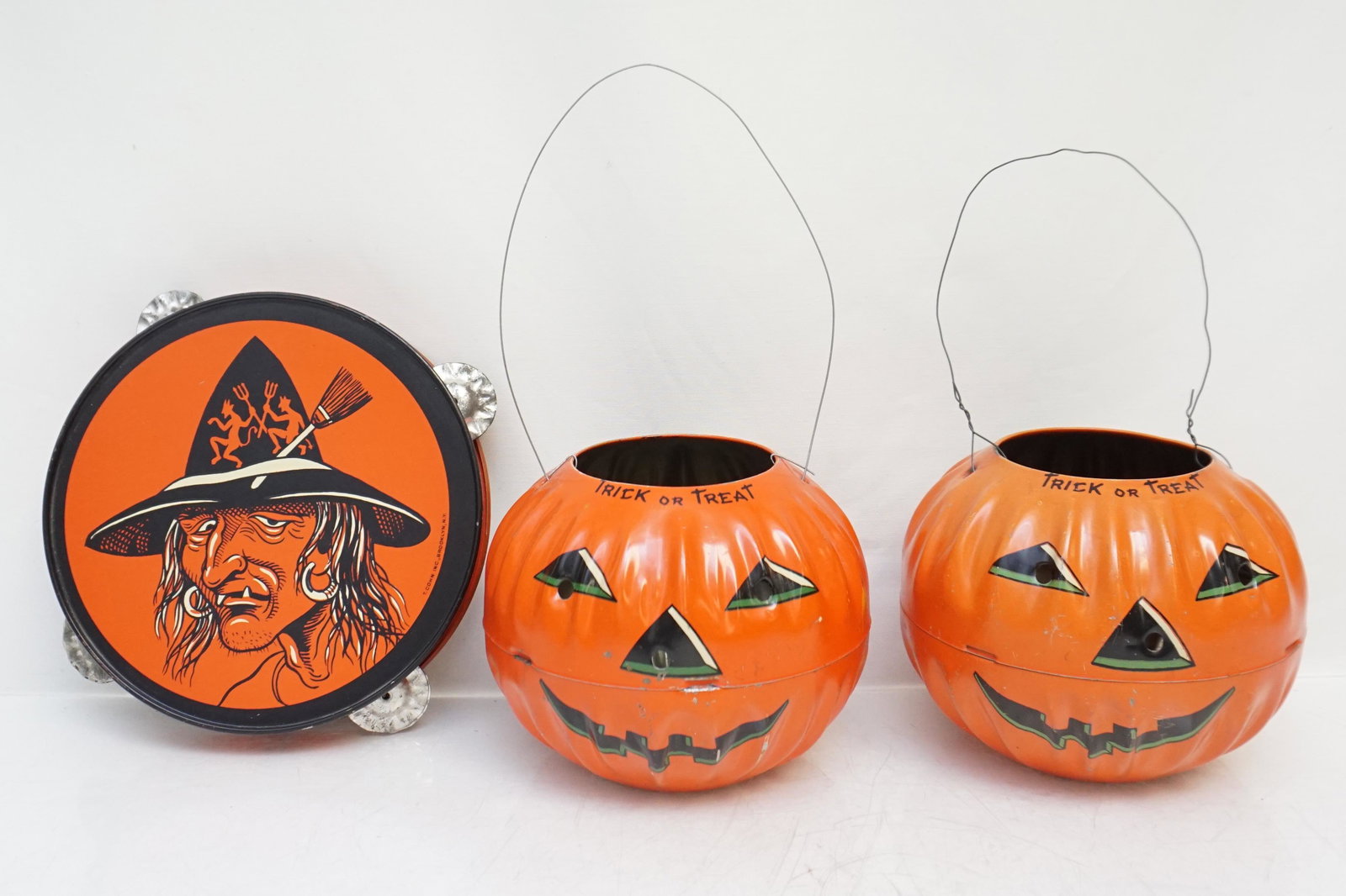 3 1950'S TIN LITHO HALLOWEEN PUMPKINS +: All are 1950s Tin Litho Halloween. 1- Scary witch tambourine made around 1950 in the USA by T. Cohn. The tin litho has bright colors and sharp graphics which include the ugly witch with additional wit