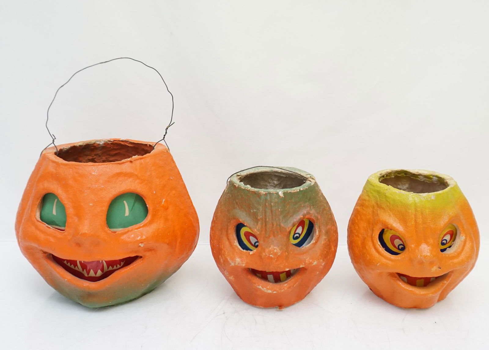 3 VINTAGE AMERICAN PULP FIGURAL HALLOWEEN LANTERNS: Three Vintage 1940s American Pulp Figural Jack O Lanterns. All made with Pulp / Pressed Paper and with paper insert. Perfect for October. Two 4"x4" and 1 6"x5 1/2". Weight 4 oz. PROVENANCE: A Private