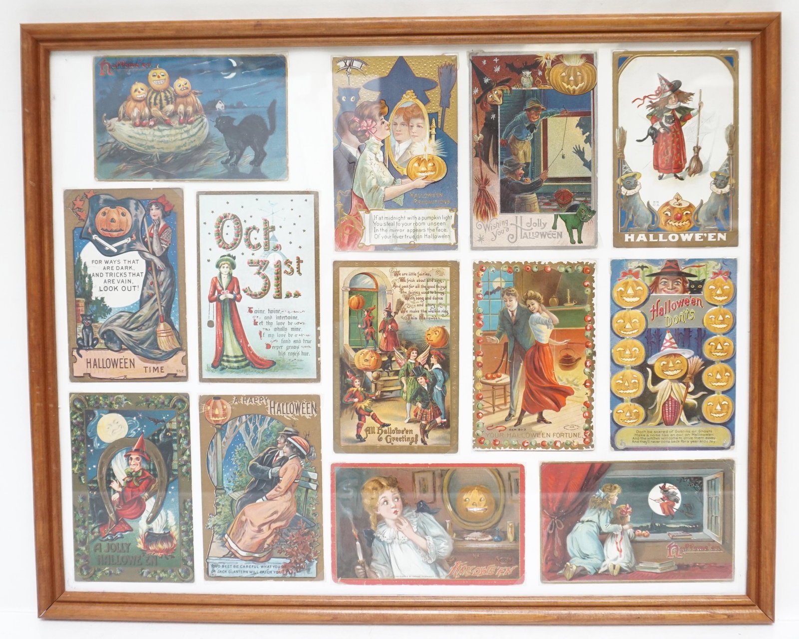 13 ANTIQUE HALLOWEEN POSTCARDS FRAMED: Thirteen Antique Late Victorian Halloween Postcards all are c. 1900-1915. Framed. Raphael Tuck and others. All in good condition. Perfect for October. Framed in wood frame under glass. Measures 17"x21