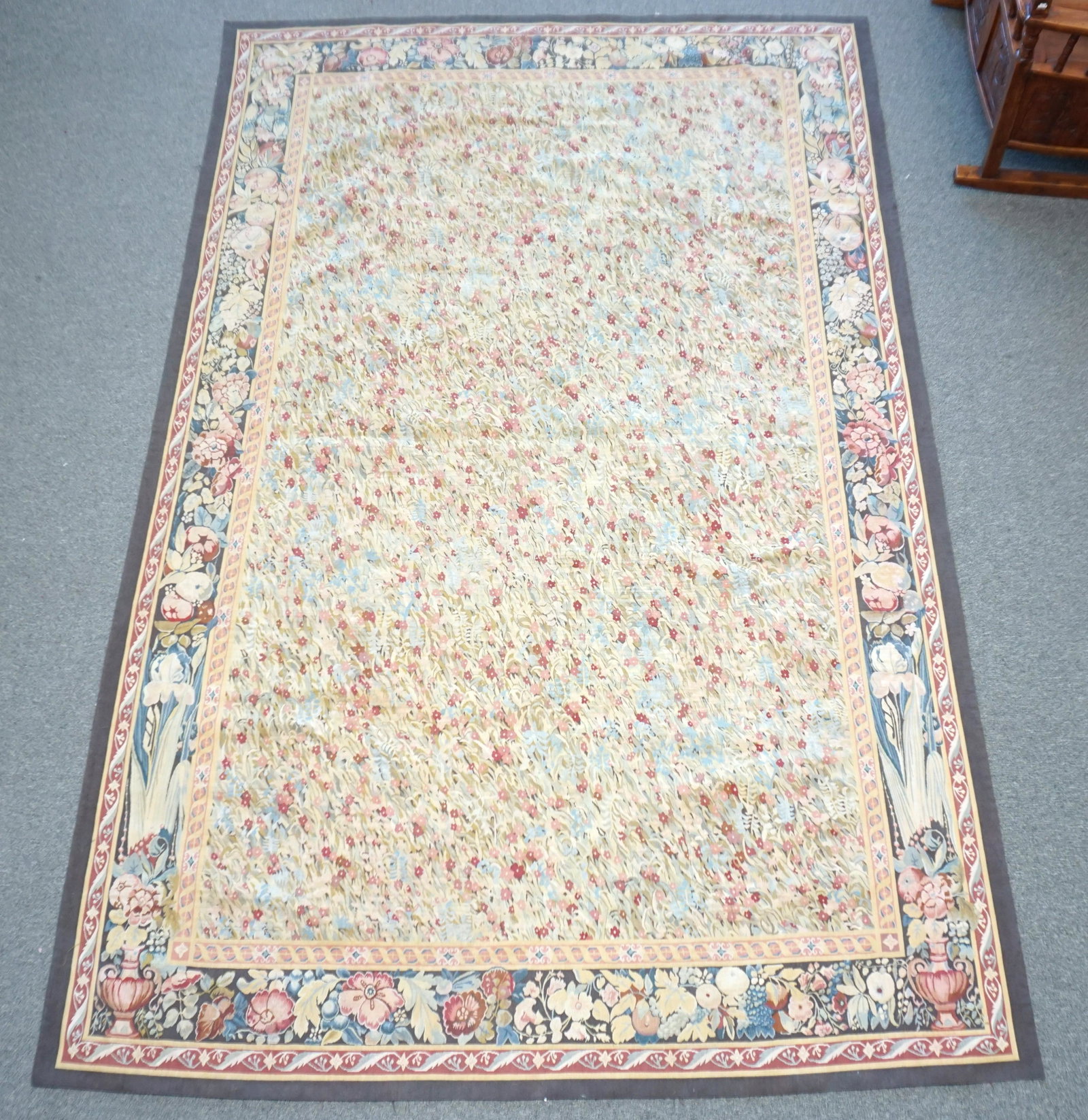 AUBUSSON-DESIGN NEEDLEPOINT HANDWOVEN WOOL: Large Aubusson Design Needlepoint Wool Rug. All over Floral Pattern. Measures 6' 10"x 10' 1". 100% wool, made in China. PROVENANCE: A Beijing China / Charleston SC Private Estate