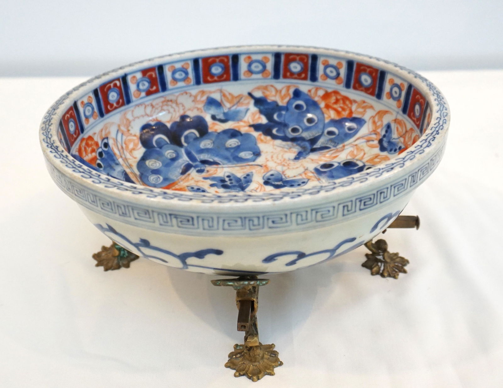 CHINESE 19th c. BOWL W STAND: Chinese Qing Dynasty Bowl c. 1860 with Butterflies painted inside and Koi on the outside. Imari Colors. Meander rim. With Brass stand. Bowl 9"x9"x3". Stand 8"x8"x2 1/2". Weight 3 pds 4 oz.