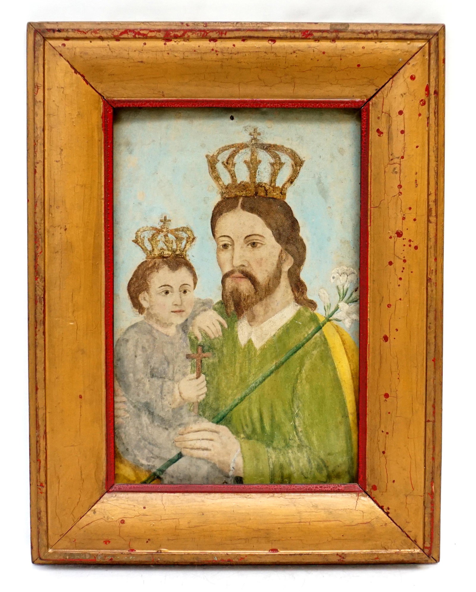 ANTIQUE SPANISH COLONIAL RETABLO: Antique Spanish Colonial Retablo, Oil on Tin, Saint Joseph and Christ Child. In Antique Wood frame gilt over red. Tin 14"x10 1/4". In frame 18 3/4"x14 1/4. Weight 3 pds.