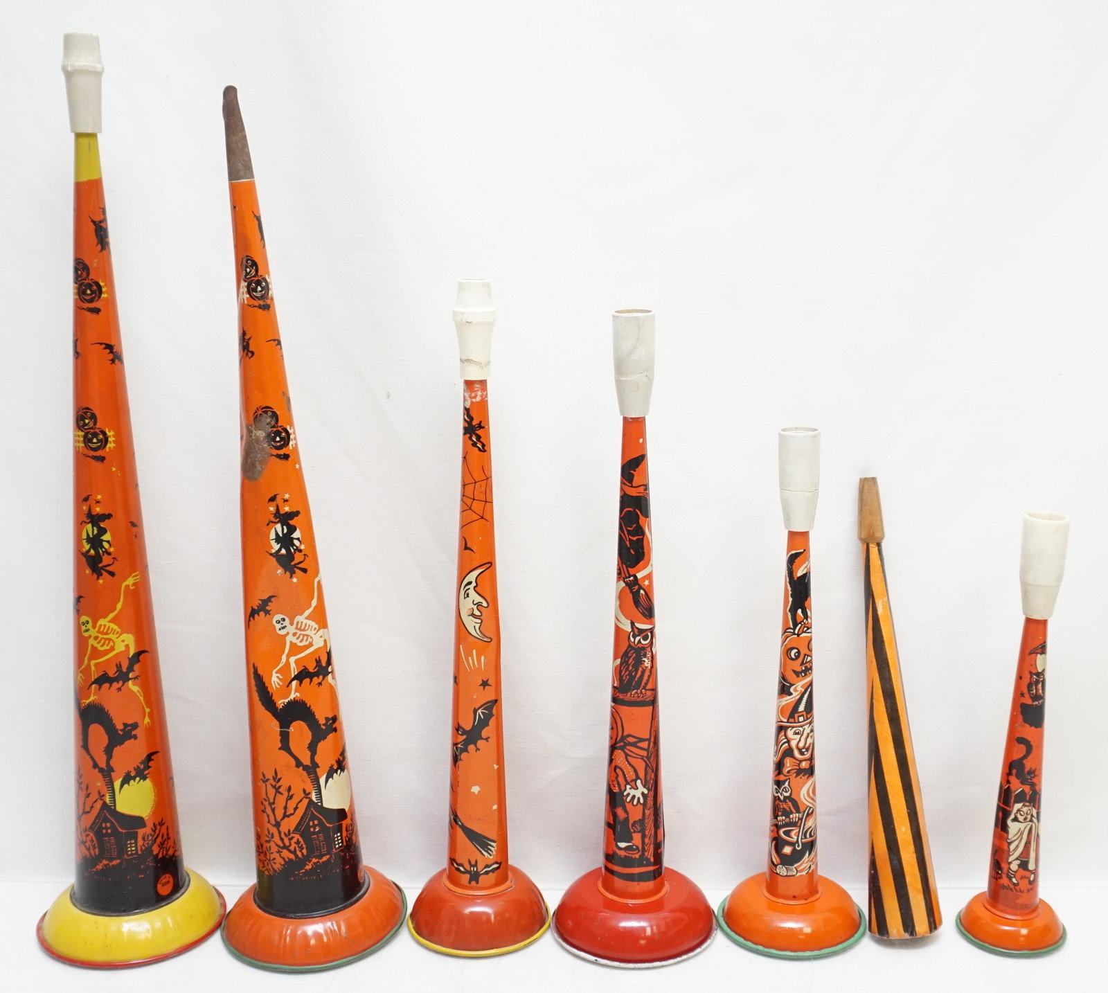 7 VINTAGE HALLOWEEN NOISEMAKERS: Six Miscellaneous Vintage Halloween Noisemakers and 1 Vintage Candy Container. Tallest 15 1/2". Weight on all 1 pd. PROVENANCE: A Private Charleston SC Estate