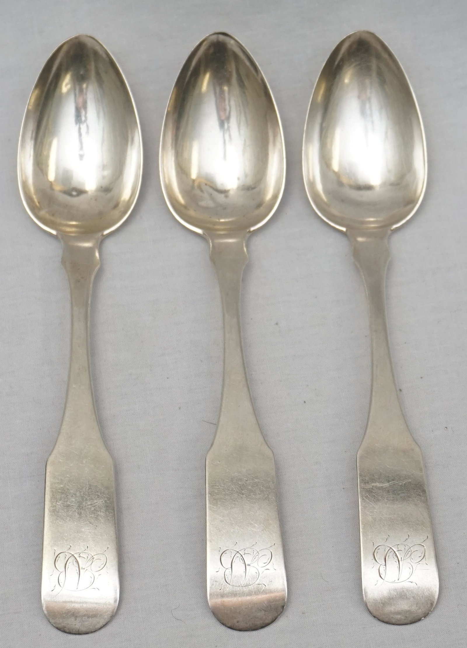 3 SAMUEL L. KIRK COIN SILVER SPOONS: Three (3) Early Samuel L. Kirk, Baltimore, Coin Silver Soup Spoons 7 1/8". Monogrammed. With the early hallmark. Weight approximately 105 grams. PROVENANCE: A Private Charleston SC Estate