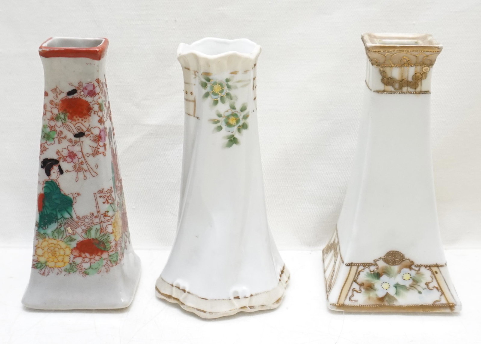 3 NIPPON / JAPAN HAT PIN HOLDERS: 3 Vintage Nippon / Japan Porcelain Hat Pin Holders / Bud Vases. All are Hand Painted. All approximately 4 3/4". Weight combined 14 oz. PROVENANCE: A Private Charleston SC Estate
