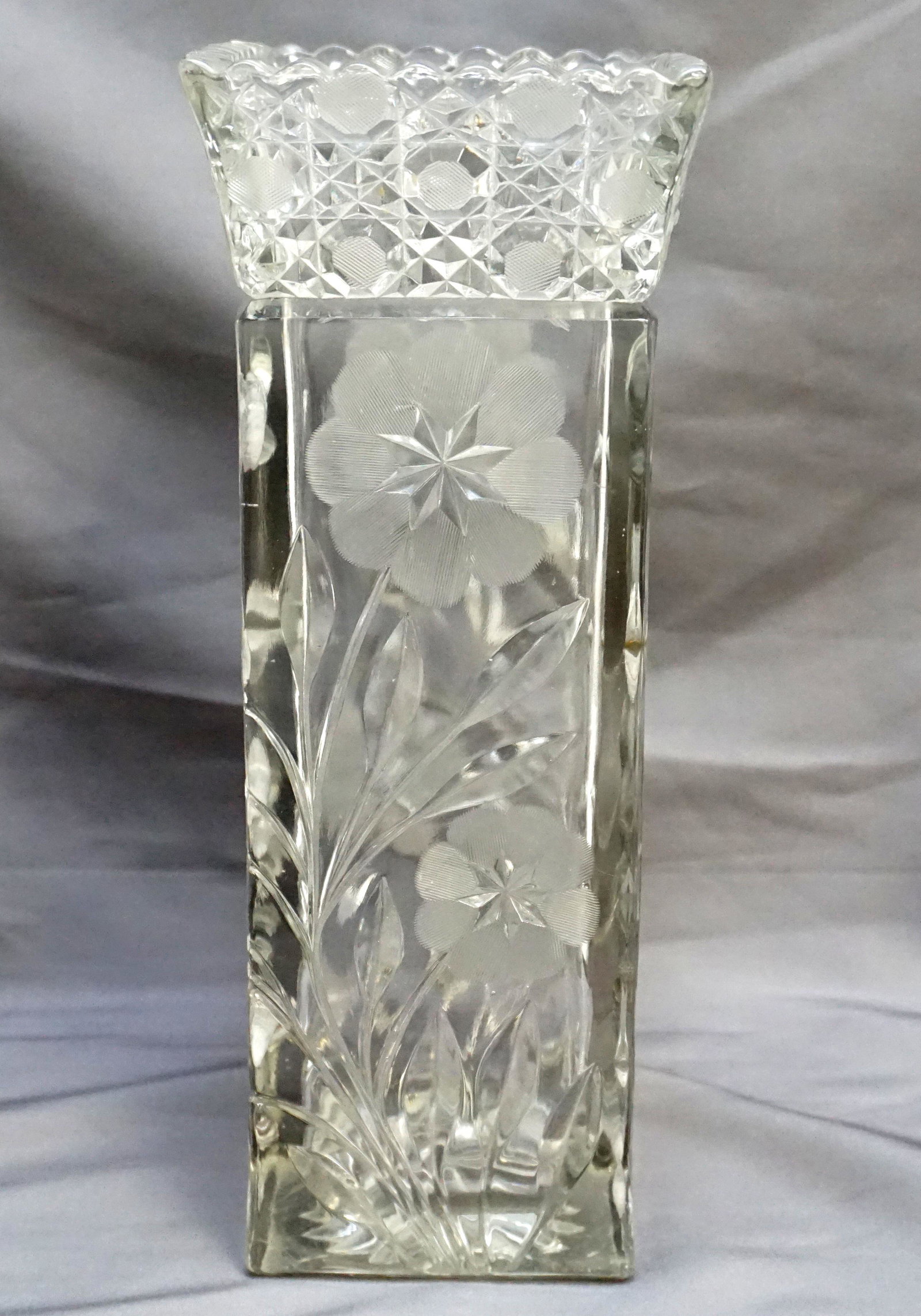AMERICAN BRILLIANT CUT GLASS VASE: Antique American Brilliant period cut glass vase, square in form and in the Harvard and Daisy pattern with floral cut and etched body. Measures 4"x4"x10". Weight 4 pds. PROVENANCE: A Private Charlesto