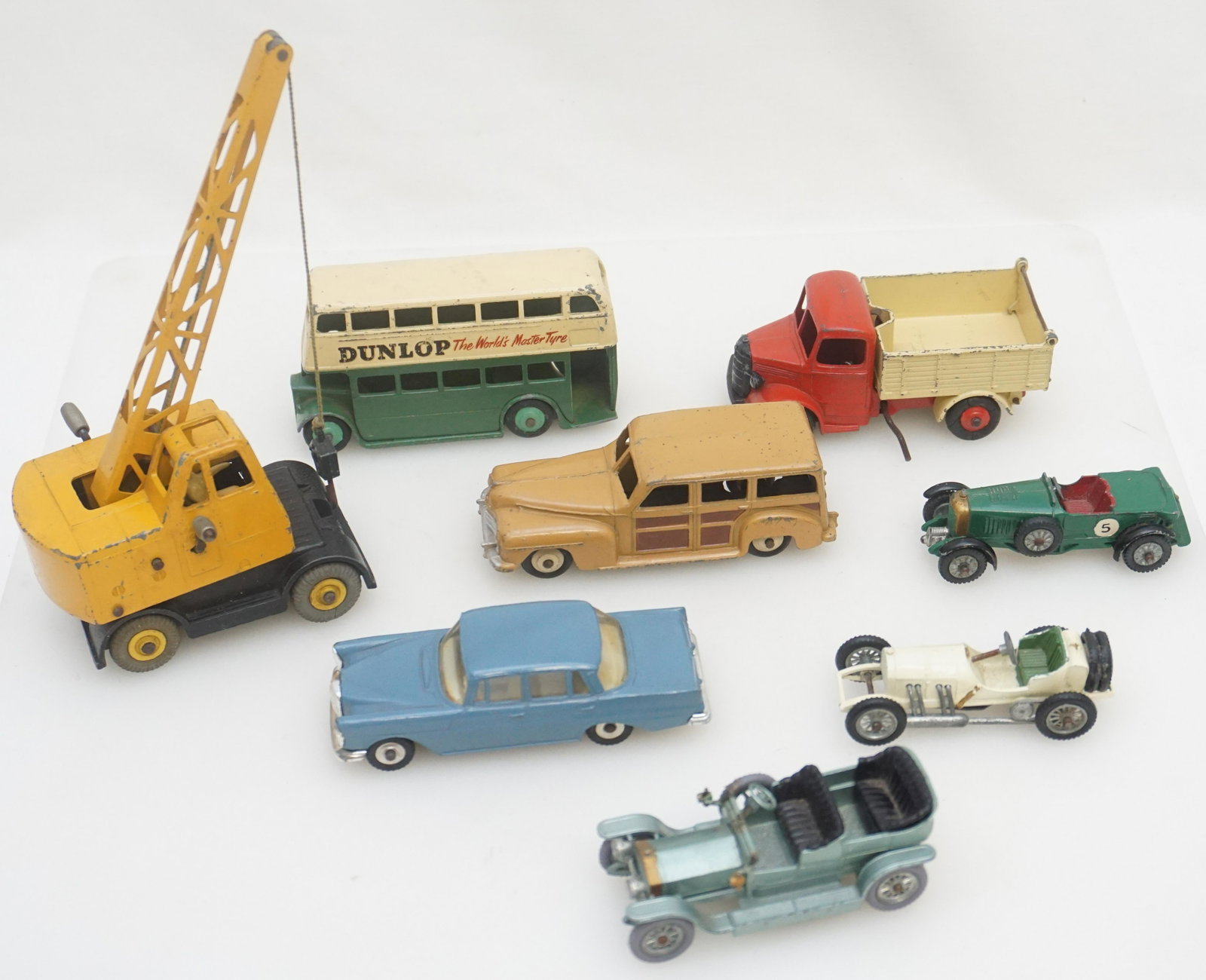 8 VINTAGE DINKY + LESNEY CARS TRUCK BUS: All are English and Vintage. 1- Dinky Toys #186 Mercedes Benz 220SE. 2- Dinky Toys #290 Double Decker Bus. 3- Dinky Toys #344 Woody. 4- Dinky Toys #410 Bedford End Tipper Truck. 5- Dinky Toys #571 Col