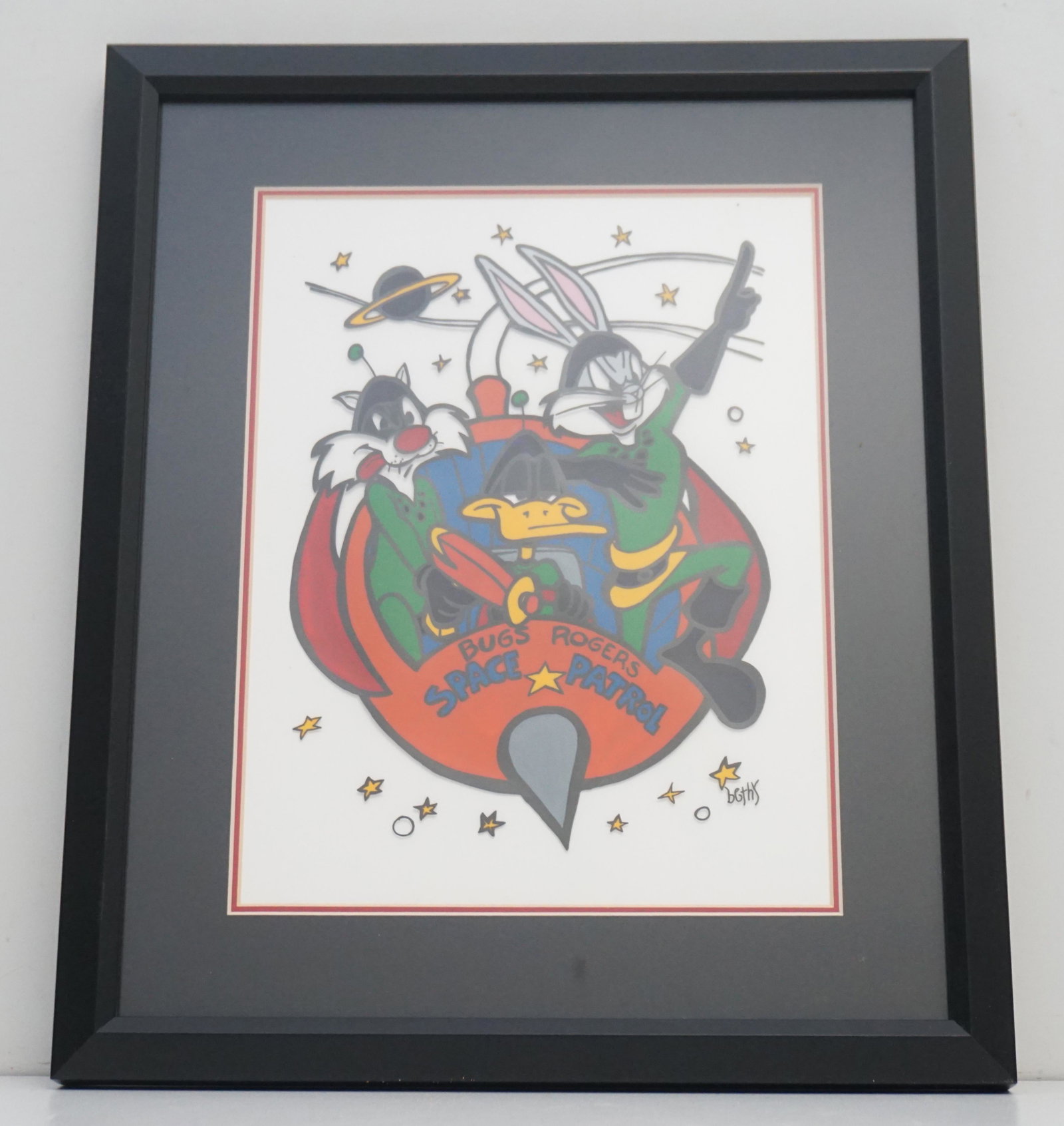 BUGS BUNNY ANIMATION CELL: Warner Brothers Animation Cell "Bugs Rogers - Space Patrol" . Artist: Bethy. Bugs Bunny, Daffy Duck and Sylvester. In contemporary black frame, double matted measures 13 3/4"x16"x1". Weight 3 pds. PRO