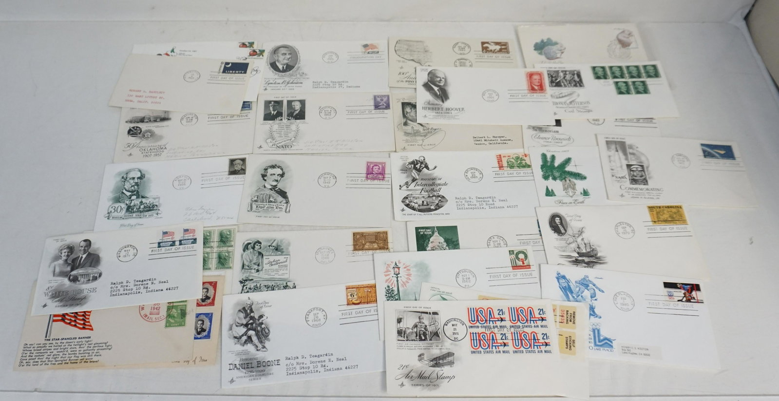 30 VINTAGE FIRST DAY ISSUE STAMPS: 30 First Day Issue Stamps and Envelopes. Including 1952 honoring Nato. 1949 Edgar Alan Poe. 1948 Will Rogers. 1969 Collegiate Football. 1965 Lyndon B. Johnson 1960 Pony Express. Many more. See photogr