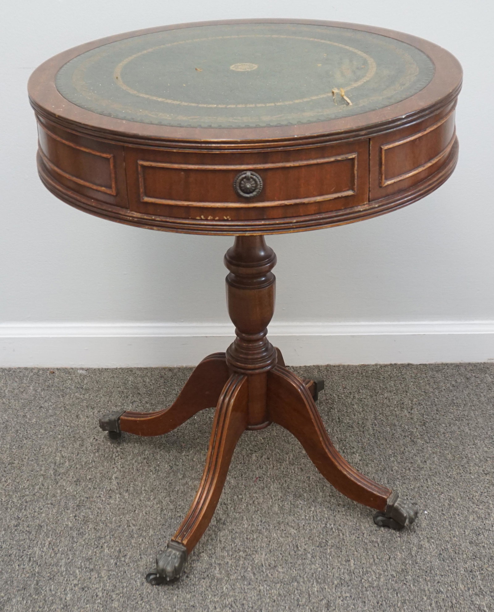 SMALL OCCASIONAL DRUM TABLE: Small Leather Top Drum Occasion Table. Tear to leather top. Measures 20"x20"x24" PROVENANCE: A Private Charleston SC Estate ***Pickup only or Shipping on this item offered through Outward Bound 413-85