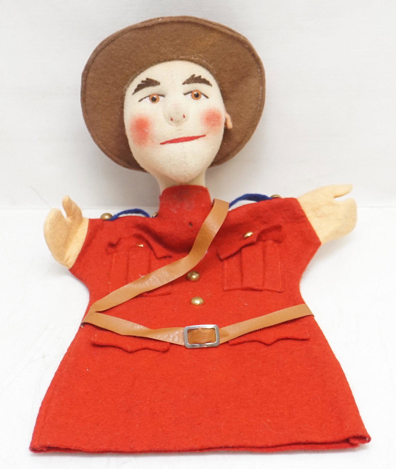 CANADIAN MOUNTED POLICE PUPPET: Vintage Felt Canadian Mounted Police Hand Puppet. Good condition, missing top button, 11". Weight 4 oz.