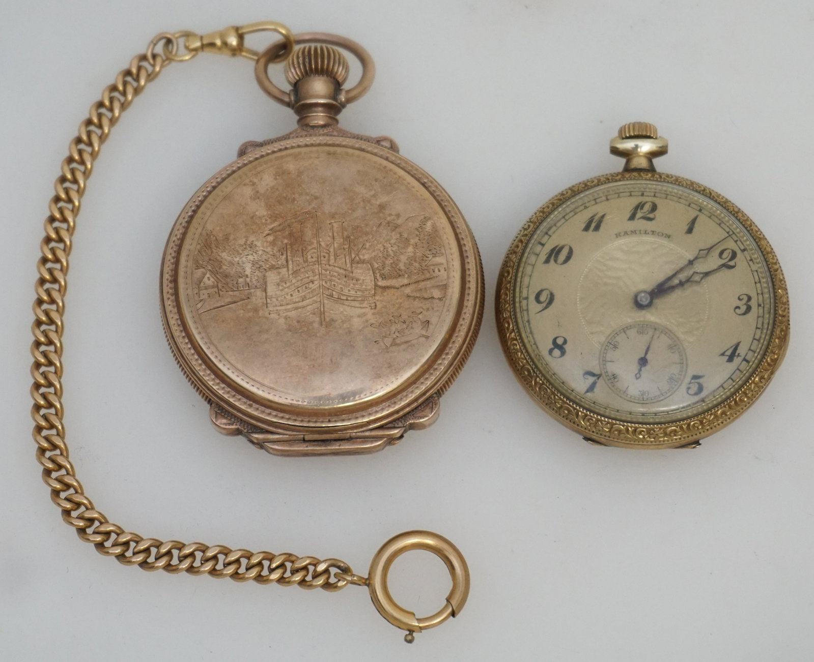2 AMERICAN POCKET WATCHES: Both American Pocket Watches. 1- Elgin National Watch Company 1884 16s, Hunter Case with gold filled fob, not running. Engraved Steamboat / Castle Case. 2- Hamilton 1923 17j., not running. Open face, 