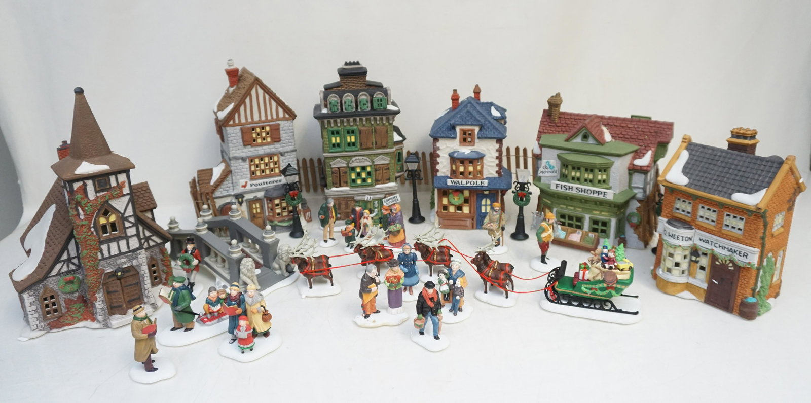 LARGE GROUP HERITAGE VILLAGE COLLECTION: Large Group Heritage Village Collection. In the Original Boxes. 1- The Mermaid Fish Shoppe. 2- Geo Weeton Watchmaker. 3- The Flat of Ebenezer. Scrooge. 4- Old Michaelchurch. 5- Walpole Tailors. 6- Pou