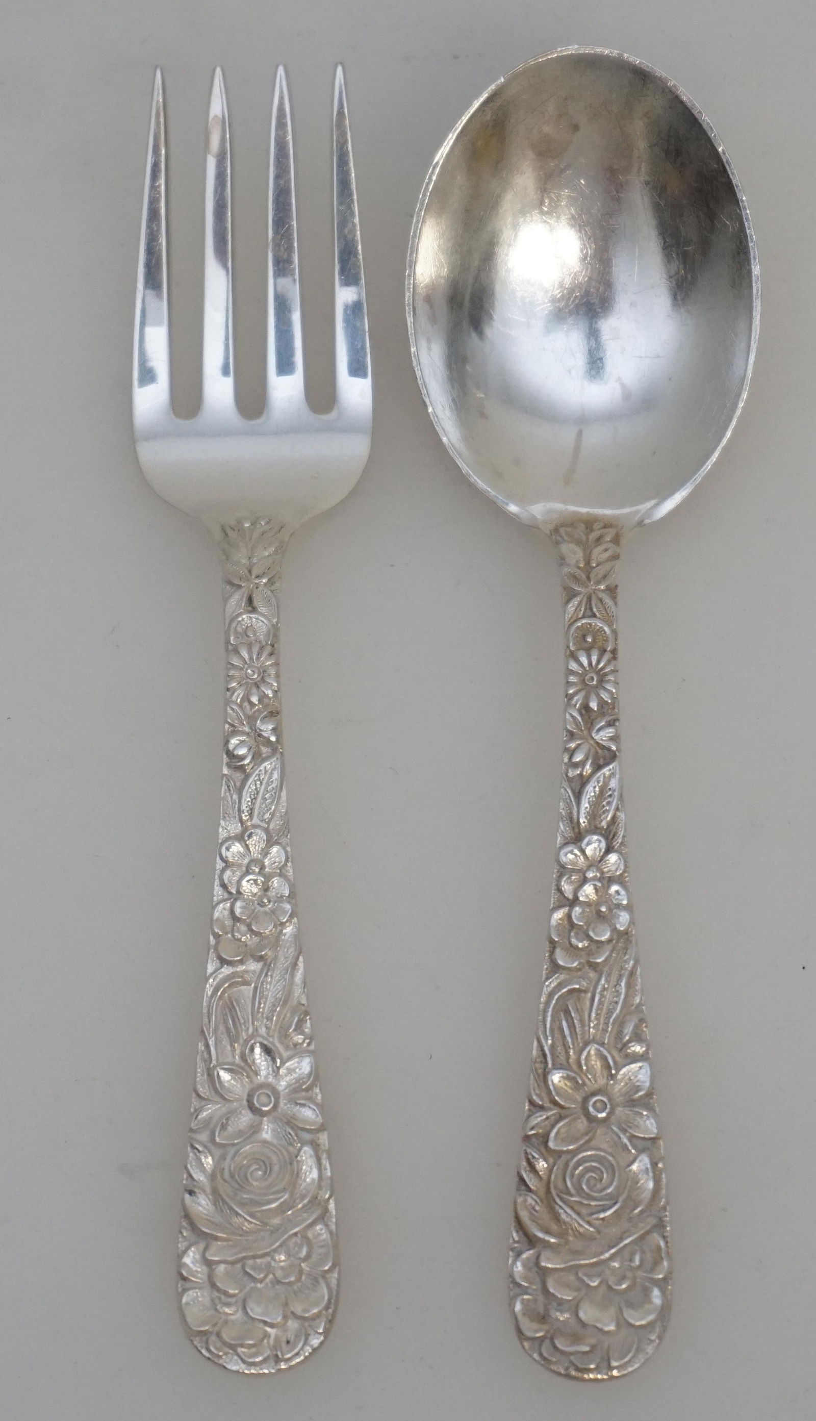 2 pc STERLING REPOUSSE S. KIRK AND SON BABY SET: 2 Sterling Silver Fork and Spoon Baby Set in the Repousse pattern by S. Kirk and Son (now, Kirk-Stieff), Baltimore, Maryland. No monograms. 4 1/4" long. Repousse was introduced into America by Samuel