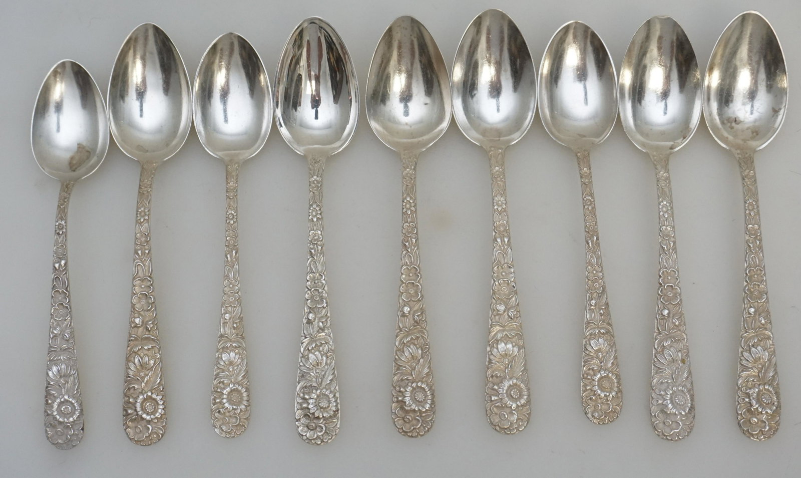 9 STERLING REPOUSSE S. KIRK AND SON TEASPOONS: 9 Sterling Silver Teaspoons in the Repousse pattern by S. Kirk and Son (now, Kirk-Stieff), Baltimore, Maryland. No monograms. Repousse was introduced into America by Samuel Kirk in 1828. This iconic A