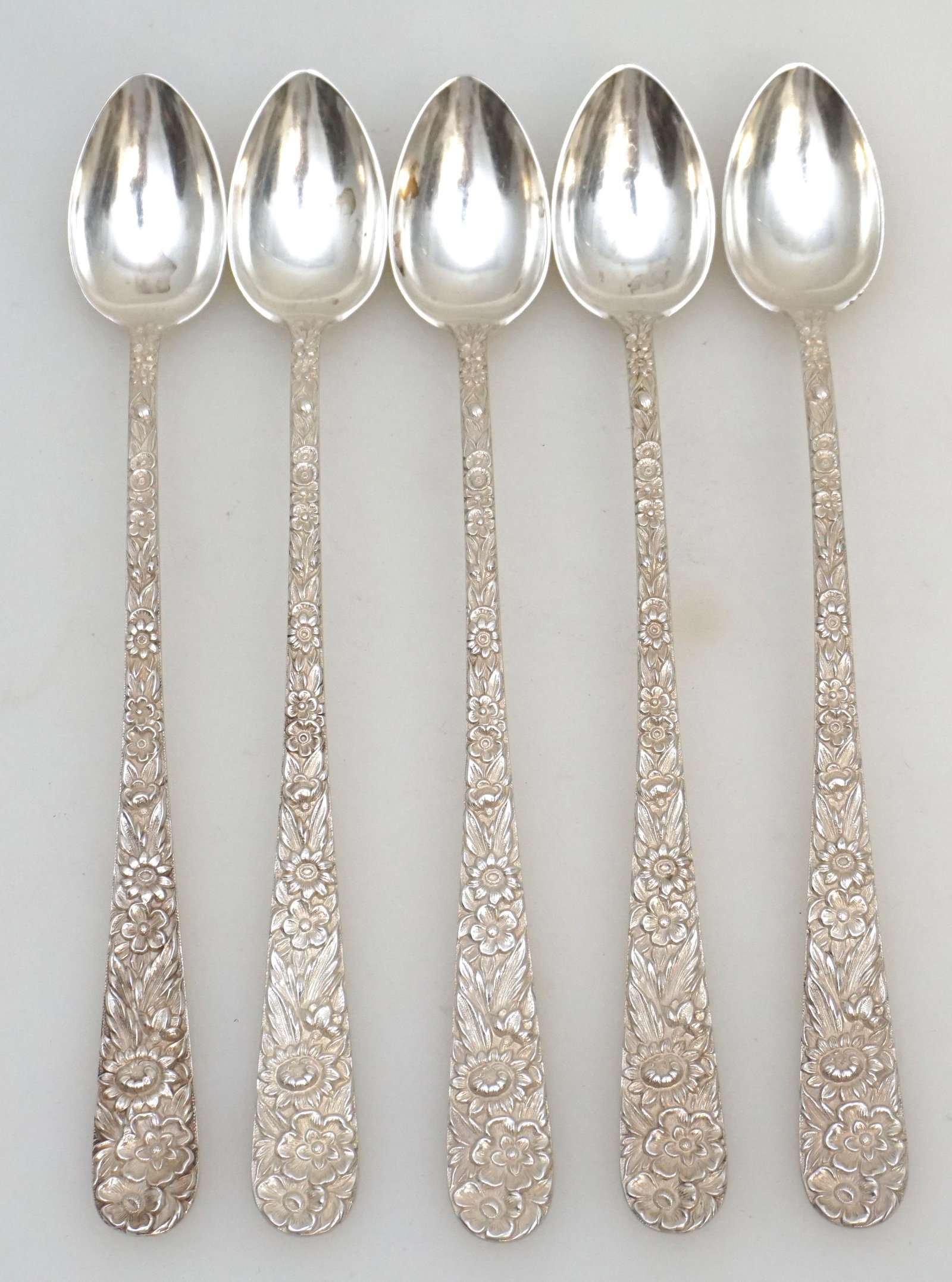 5 STERLING REPOUSSE S. KIRK AND SON ICED TEA SPOONS: 5 Sterling Silver Iced Tea Spoons in the Repousse pattern by S. Kirk and Son (now, Kirk-Stieff), Baltimore, Maryland. No monograms. Repousse was introduced into America by Samuel Kirk in 1828. This ic