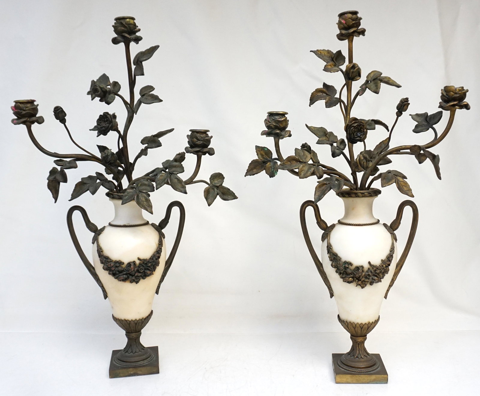 PAIR OF LOUIS XV BRONZE & ALABASTER CANDELABRA: Matched Pair of Louis XV Bronze and Alabaster 3 Light Candelabra. The urn-shaped bodies raised on acanthus leaf bronze bases. Bronze floral swags and handles. Surmounted by naturalistic branches, leav