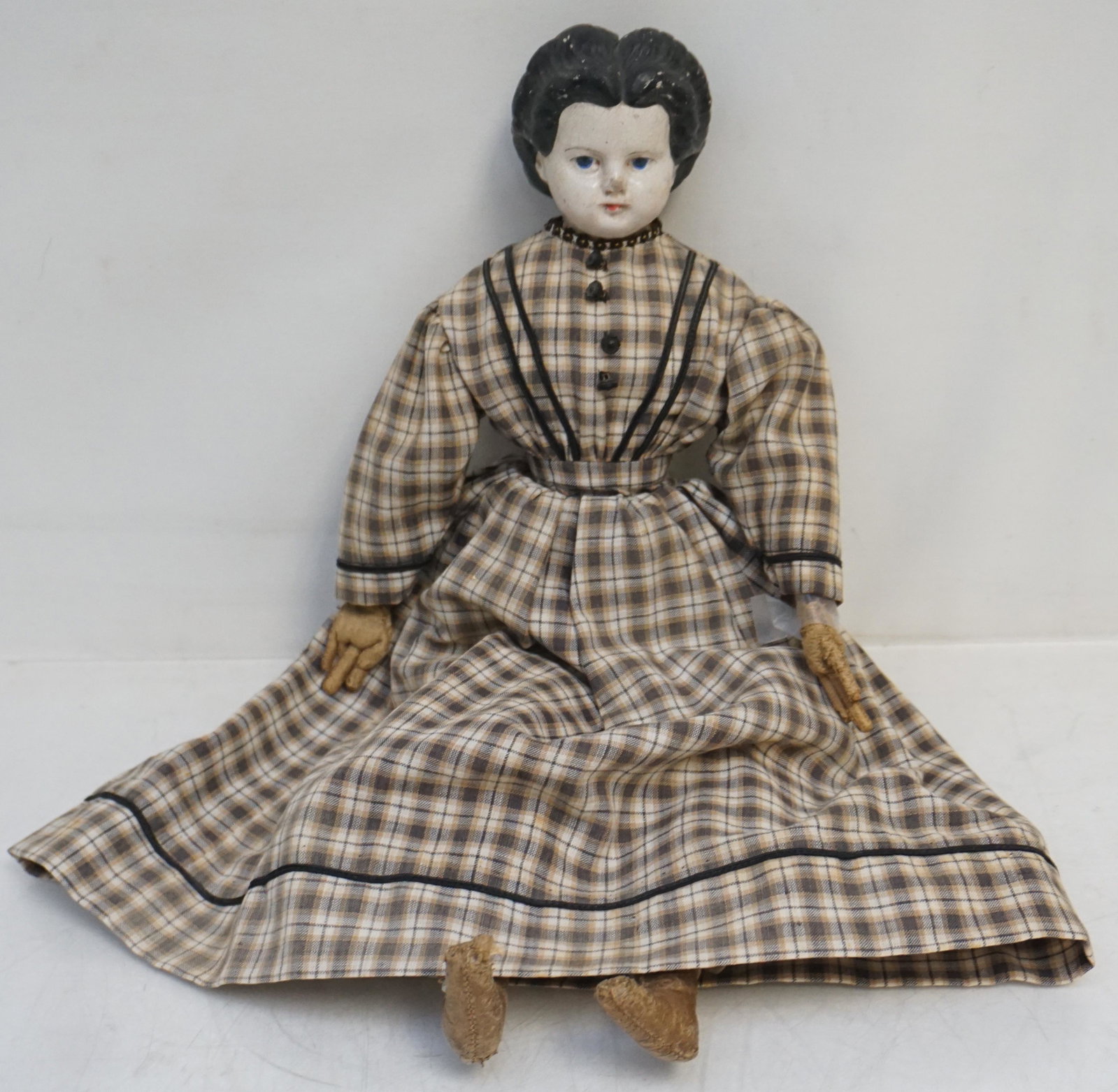 EARLY GRENIER PAPIER MACHE DOLL: Antique 19th c. Papier Mache Head Greiner Doll, No. 3. Still retains part of the original paper label to back pat. 58. Cloth Body, kid arms and shoes. 15". Weight 12 oz. Ludwig Greiner was an American