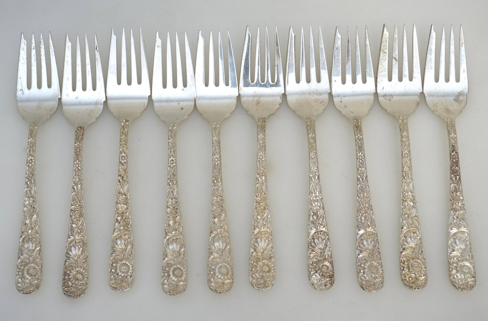 10 STERLING REPOUSSE S. KIRK AND SON SALAD FORKS: 10 Sterling Silver Individual Salad Forks in the Repousse pattern by S. Kirk and Son (now, Kirk-Stieff), Baltimore, Maryland. No monograms. Repousse was introduced into America by Samuel Kirk in 1828.