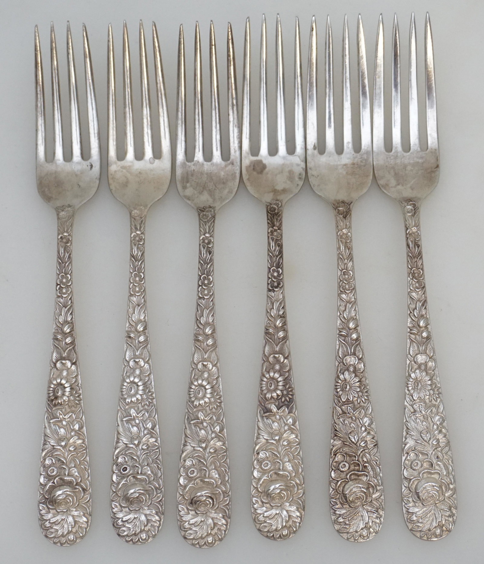 6 STERLING REPOUSSE S. KIRK AND SON FORKS: Six Sterling Silver Forks in the Repousse pattern by S. Kirk and Son (now, Kirk-Stieff), Baltimore, Maryland. No monograms. Repousse was introduced into America by Samuel Kirk in 1828. This iconic Ame