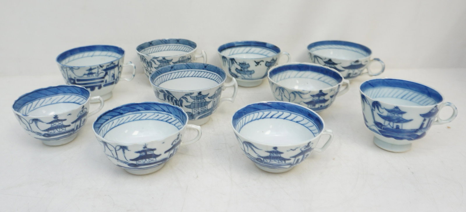 TEN CHINESE BLUE CANTON CUPS: Ten (10) Chinese Export Blue and White Canton Cups. Varied. Weight 3 pds. From the collection of Dr. Fraser Wilson of Charleston, SC. Dr. Wilson's Blue Canton collection was so complete, it was borrow