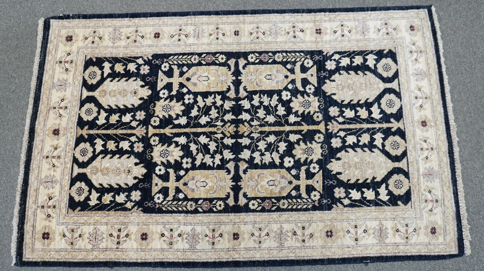 HAND KNOTTED KAZAK WOOL RUG 5 FT: Fine Authentic Hand Knotted 100% wool Pile Geometric pattern Kazak rug in decorative tan, black and taupe multi accent colors Hand Knotted in Pakistan. Measures 5 feet 1 inch x 3 feet 1 inch. Weight 8