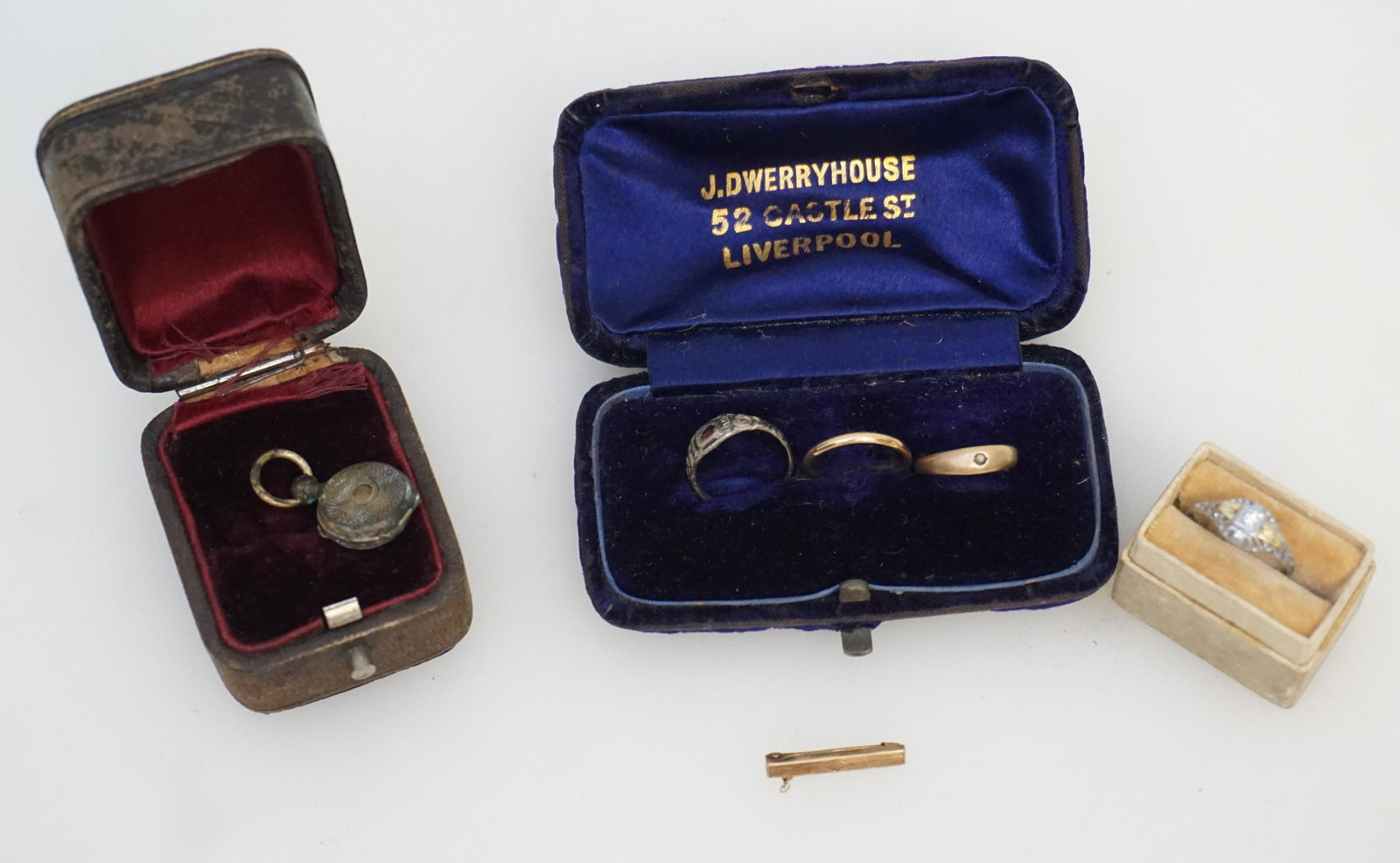 LOT VICTORIAN CHILDRENS JEWELRY: Group of 19th c. Victorian Childrens Jewelry. 1- Tiny brass Locket Memento Mori with hair, some tarnish. 2- Silver ring with Red Stone size 1.25. 3- 10k White Gold Ring with White Stone size 3. 4- Sma