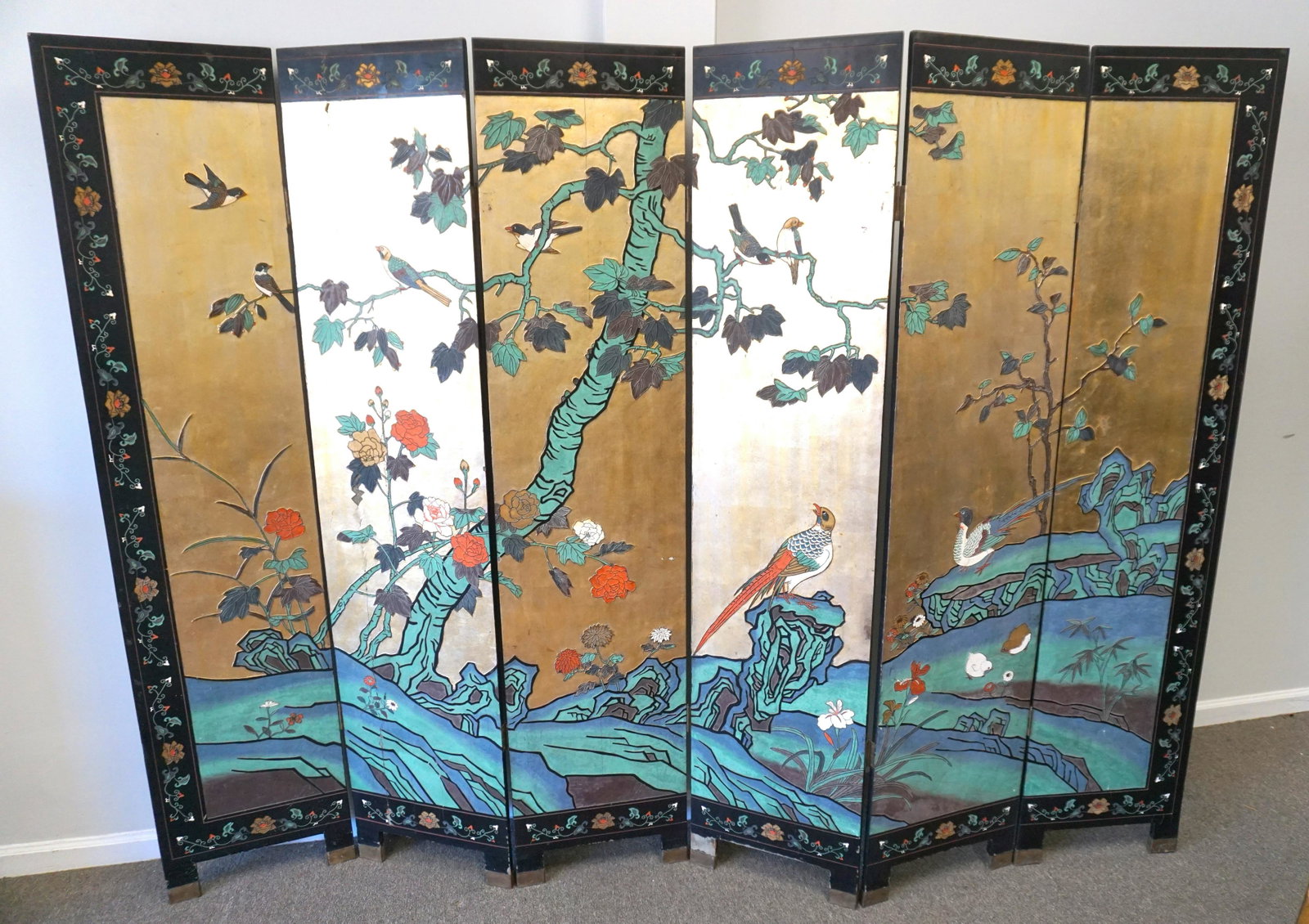 CHINESE SIX PANEL LACQUER SCREEN: Mid Century Chinese Six Panel Folding Screen. Both sides with painted birds and foliage. One side with gold, the other with black. Brass capped feet. Some wear,see photos. Measures 16" wide, 72" tall 