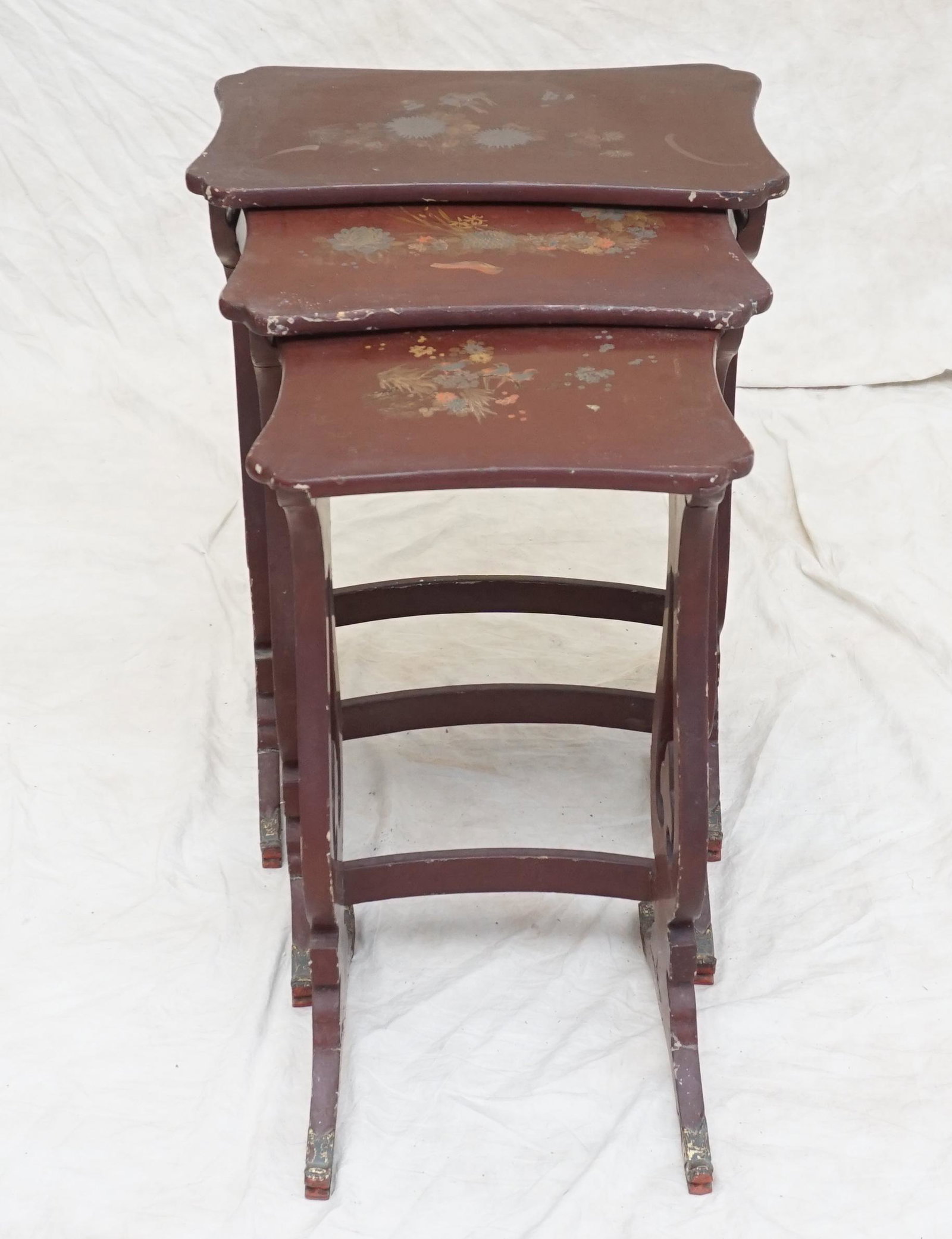 3 ANTIQUE CHINESE NESTING TABLES: Antique Set of 3 Chinese Lacquered Wood Tables, each top decorated with birds and Foliage. All with dragon feet. Wear. Tallest 19 1/2"x13"x27 1/2". PROVENANCE: The Estate of Dr. Fraser Wilson, Charles