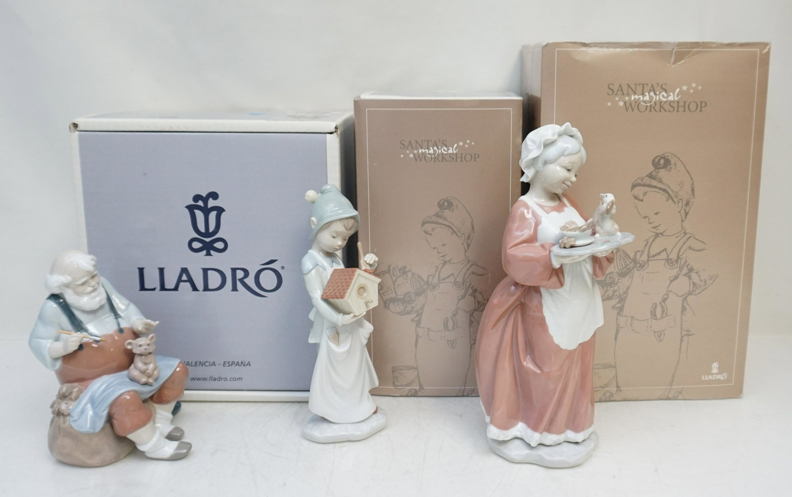 3 LLADRO PORCELAIN SANTAS MAGICAL WORKSHOP: All in original boxes. 1- A Brushstroke of Dreams #6891. Figurine 8 1/2" Retired 2008. Box 6"x11"x5". 2- Mrs. Santa Claus #6893. Figurine 101/4". Retired 2008. Box 6"x8"x12 1/2". 3- Santas Magic Touch