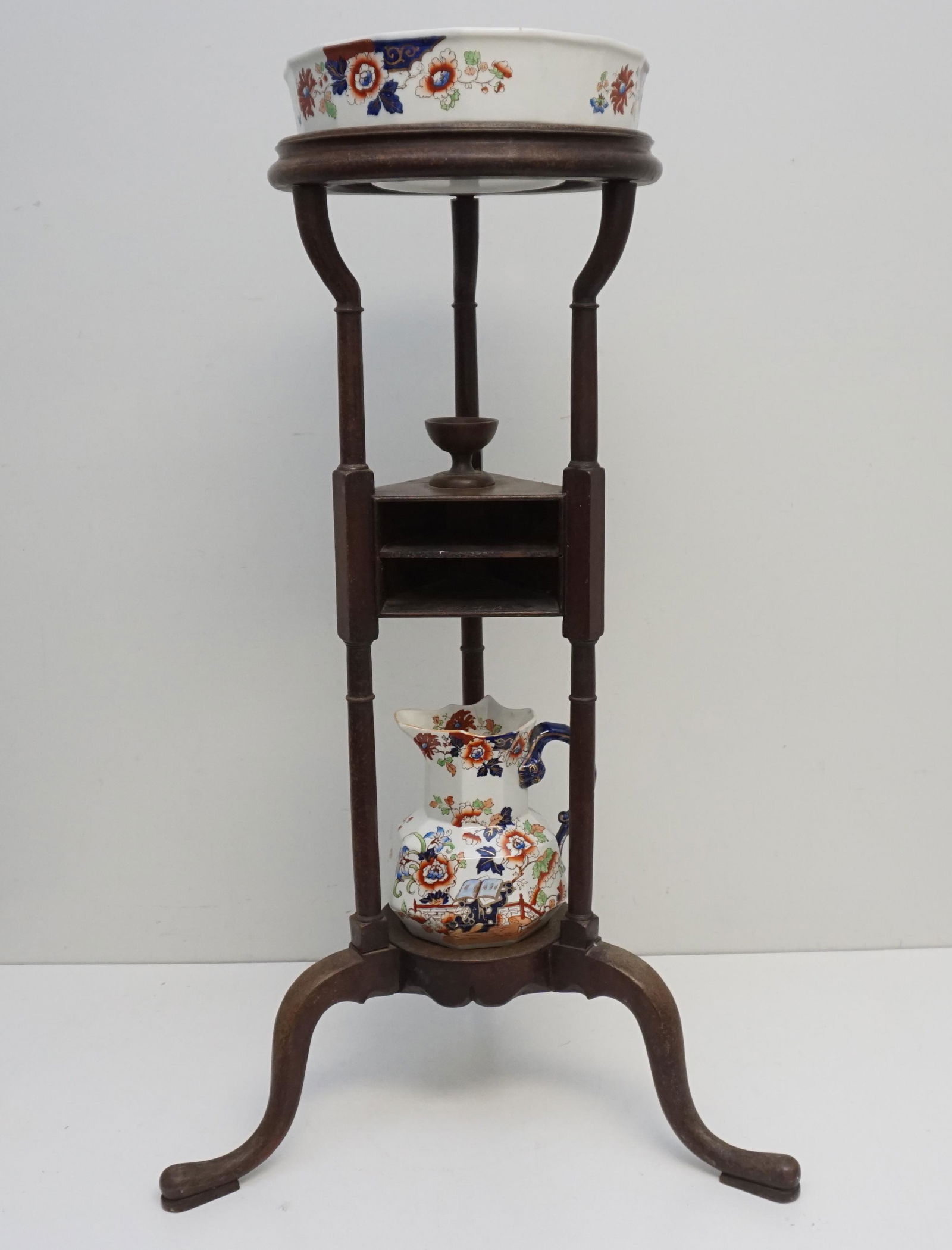 MAHOGANY WASH BASIN STAND + MASONS IRONSTONE: Antique English 19th c. Mahogany Washstand on Queen Anne Legs with Wash Basin and Pitcher. The Basin and Pitcher are Masons Ironstone. Lip of pitcher with old repair. Missing the drawers in the stand.