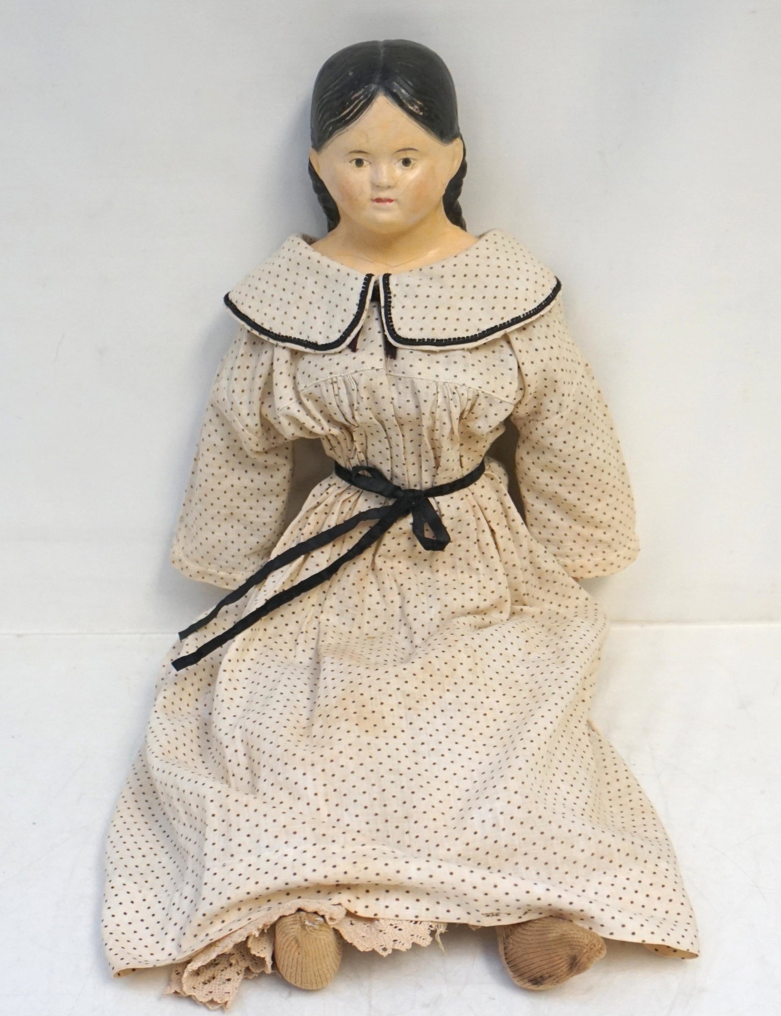 EARLY GRENIER PAPIER MACHE DOLL: Antique 19th c. Papier Mache Head Large Greiner Doll. Cloth Body, kid arms. 21". Weight 1pd 7 oz. Ludwig Greiner was an American doll maker in 1840-1874 and 1874-1883 as Ludwig Sons. In 1883 the compa