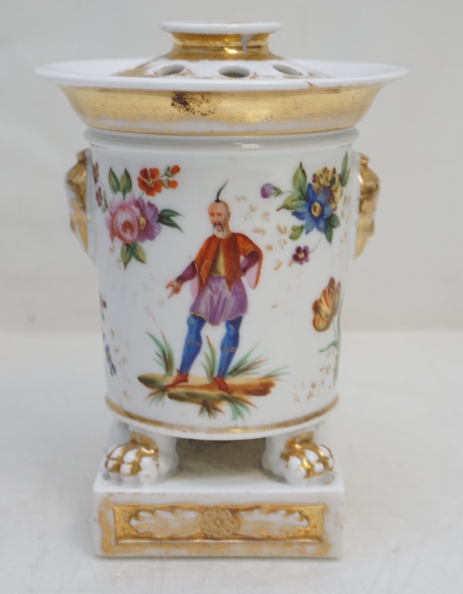 OLD PARIS VASE WITH FLOWER FROG: Antique Old Paris Hand Painted Vase / Cachepot with Flower Frog. Measures 3"x3"x6 1/2". Weight 1 pd 5 oz.Old repair to rim, wear to gilt. PROVENANCE: The Estate of Dr. Fraser Wilson, Charleston SC. Dr