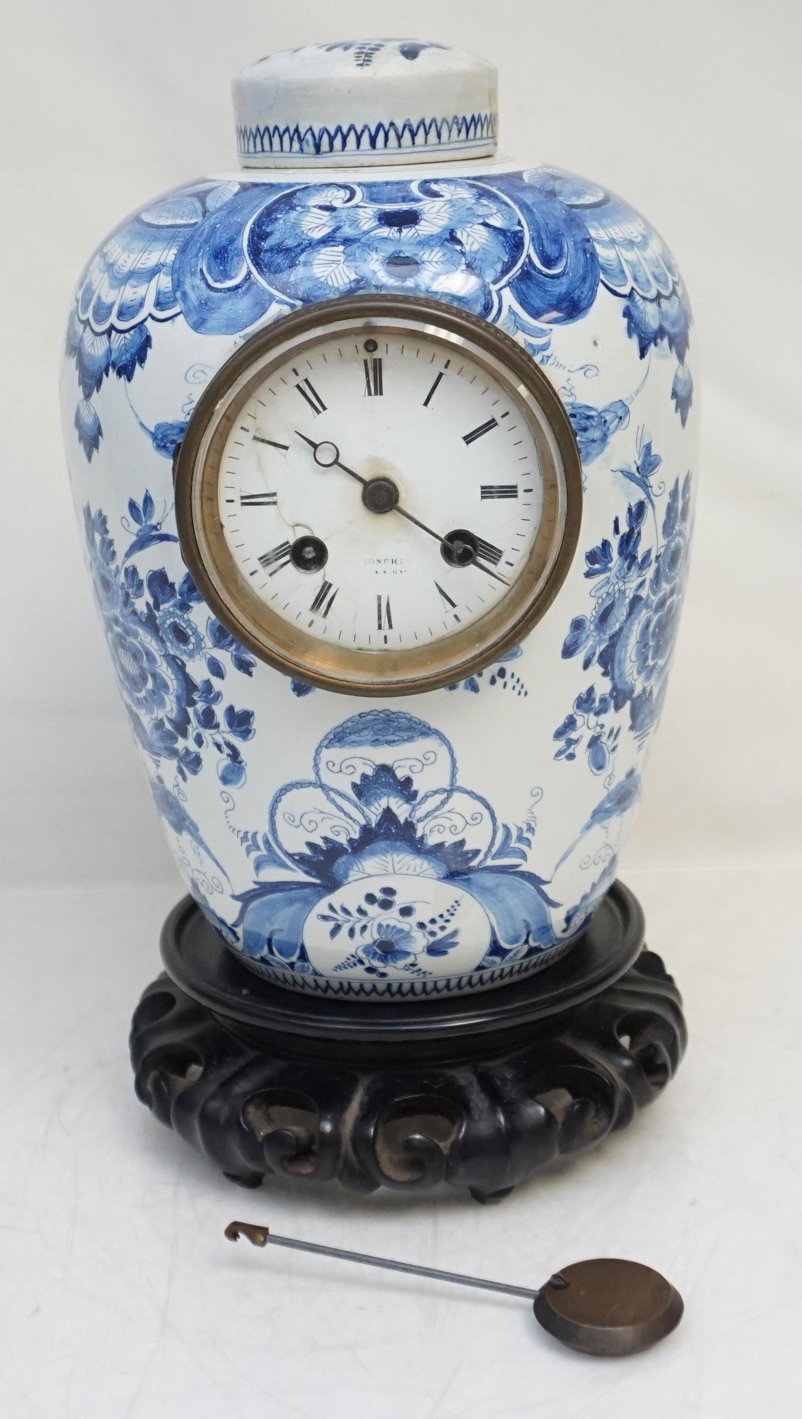 ANTIQUE DELFT PORCELAIN CLOCK 19th C.: Antique 19th c. Delft Porcelain Clock. Lidded Jar. Top has been glued, old break. Clock measures 6 1/2"x6 1/2"x10 1/4". Weight 7 pds. 10 oz. PROVENANCE: The Estate of Dr. Fraser Wilson, Charleston SC.
