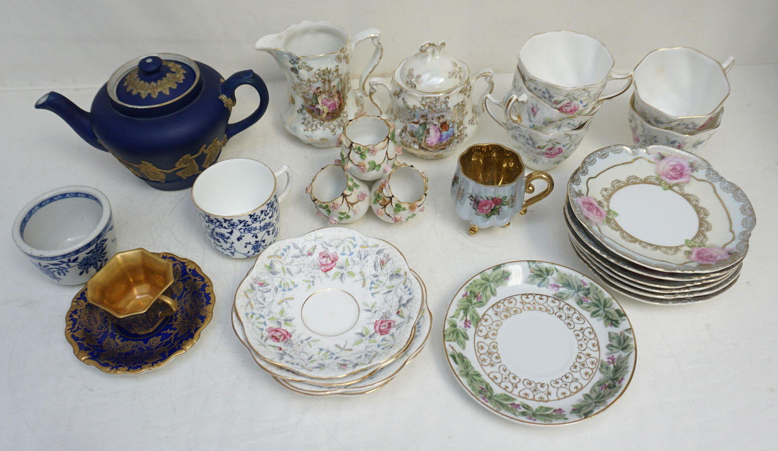 BOX LOT PORCELAIN & CHINA: 1- Cobalt and Gilt Occupied Japan Cup and Saucer, 2- Six (6)Rose and Gilt Bread and Butter Plates 5 1/2". 3- Coronet Cobalt and Gilt Teapot England. 4- Pearl Lusterware Cream and Sugar. 5- Vintage vis