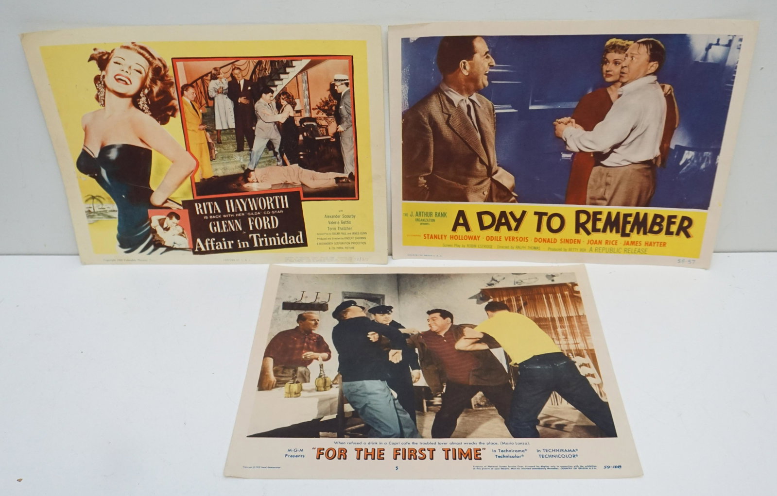 3 ORIGINAL 1950s LOBBY CARDS: 3 Original 1950s Lobby Cards. Rita Hayworth and Glenn Ford "Affair in Trinidad" 1952. Stanley Holloway, Donald Sinden and Bill Owen "A Day to Remember" 1953. Mario Lanza "For the First Time" 1959. All