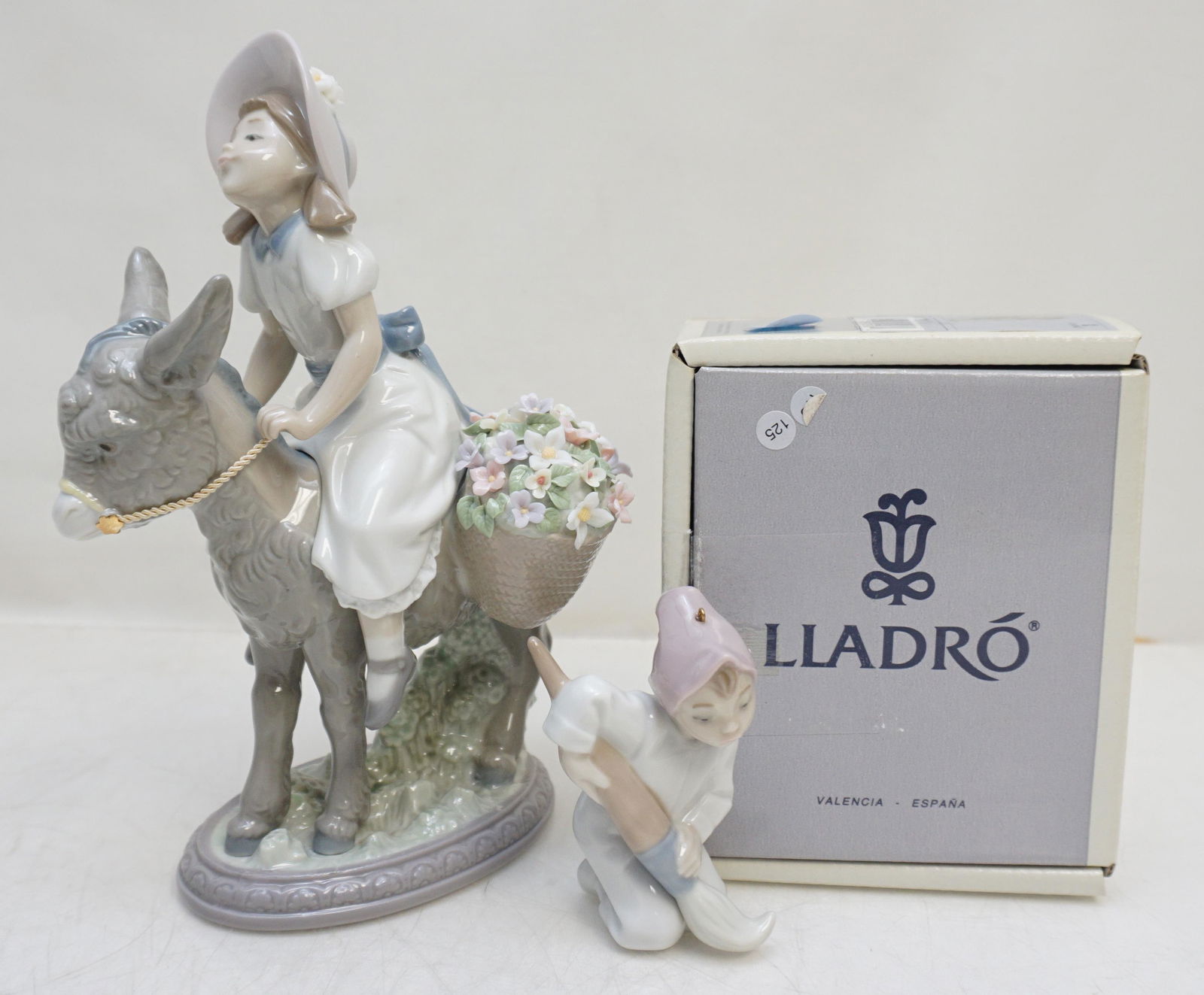 2 LLADRO PORCELAIN FIGURINES: 1- Look at Me #5465. Retired in 2005. 7 3/4" high, 5 1/2" wide. No box. 2- Lladro 5938 Elf Ornament in Original Box. 3 3/4" Retired in 1994. Great Gifts. Weight 2 pds 3 oz. PROVENANCE: A Private Charl