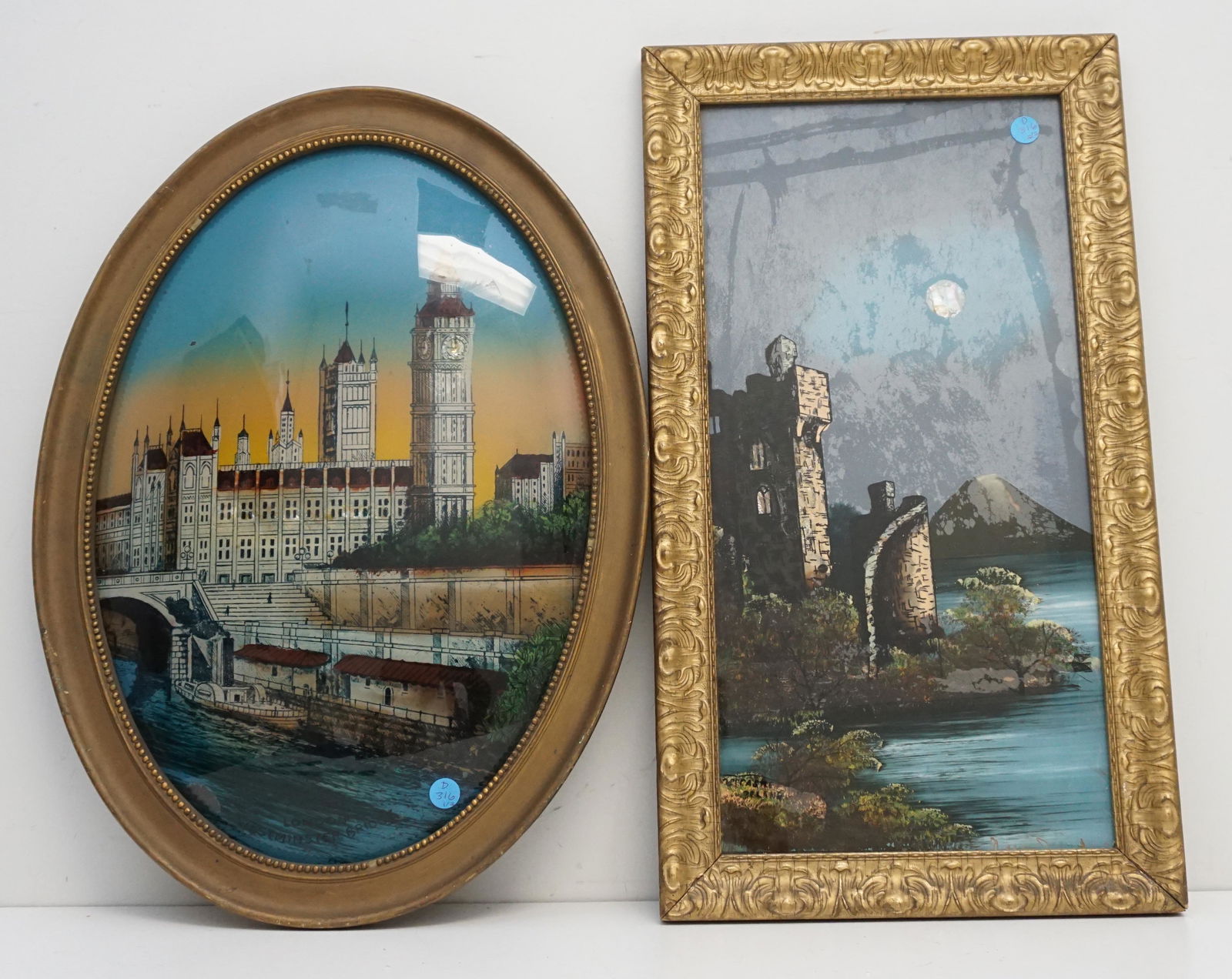 TWO REVERSE PAINTED GLASS PICTURES: 1- Antique Oval Reverse Bubble Glass Painting of Big Ben and Westminster Bridge. Wood Frame. In frame 22"x15 1/2"x1". 2- Castle by Moonlight 12 1/2"x22 1/2"x1". Weight combined 7 pds 8 oz. PROVENANCE: